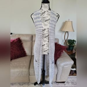 Womans sleeveless duster cardigan from Rickis. Size medium/large.